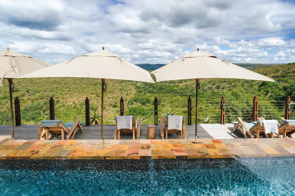Pool deck of Rhino Ridge Safari Lodge overlooking the hills of the Hluhluwe-iMfolozi Park in KwaZulu Natal